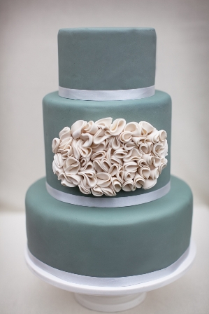 Blue cake with white ruffle design