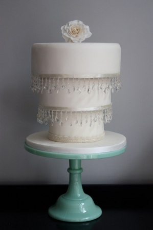 White reverse cake on teal stand